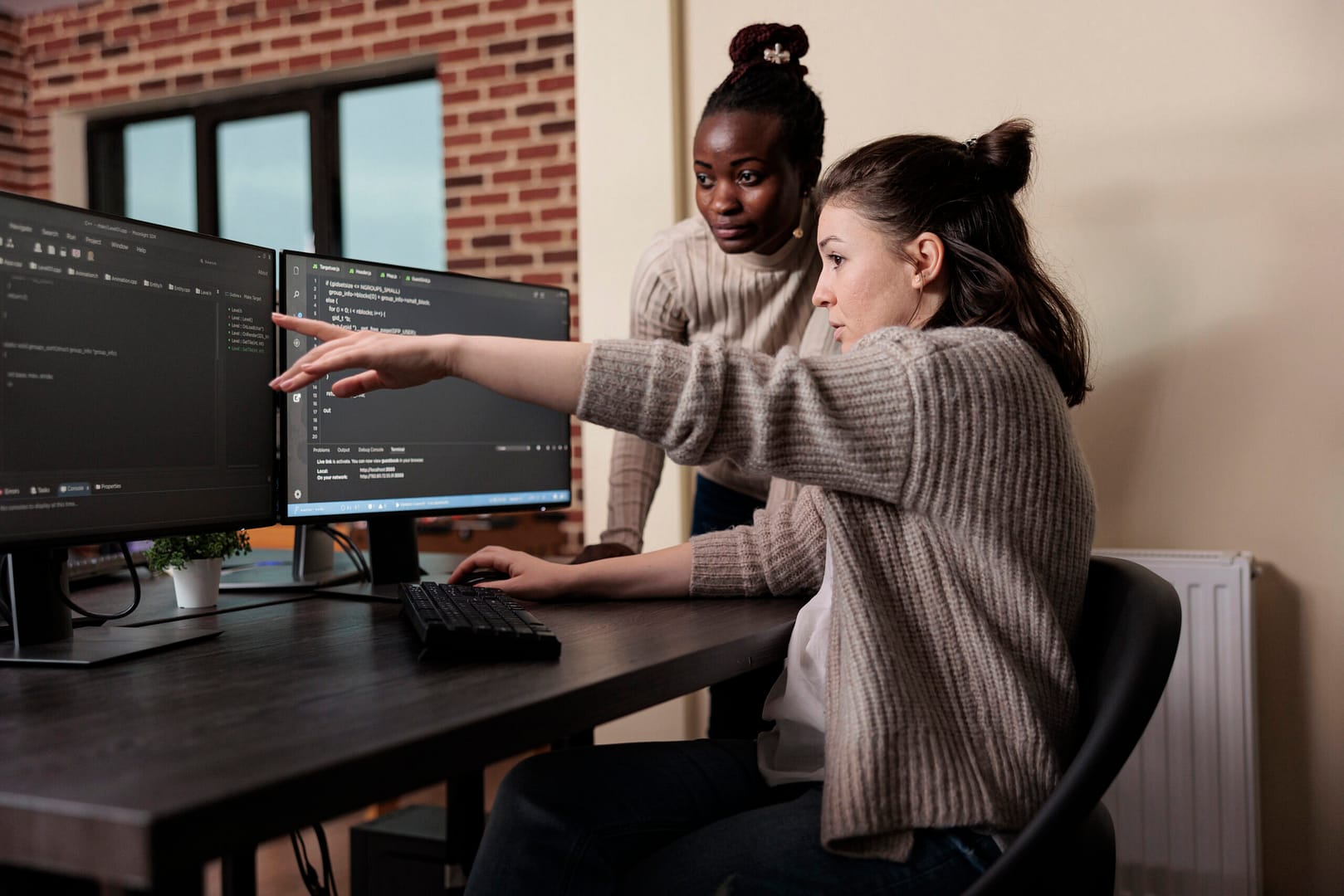 AviTV 4 caucasian network developer pointing out high usage processing power mainframe grid african american programmer helping coworker solve overloaded system storage space scaled