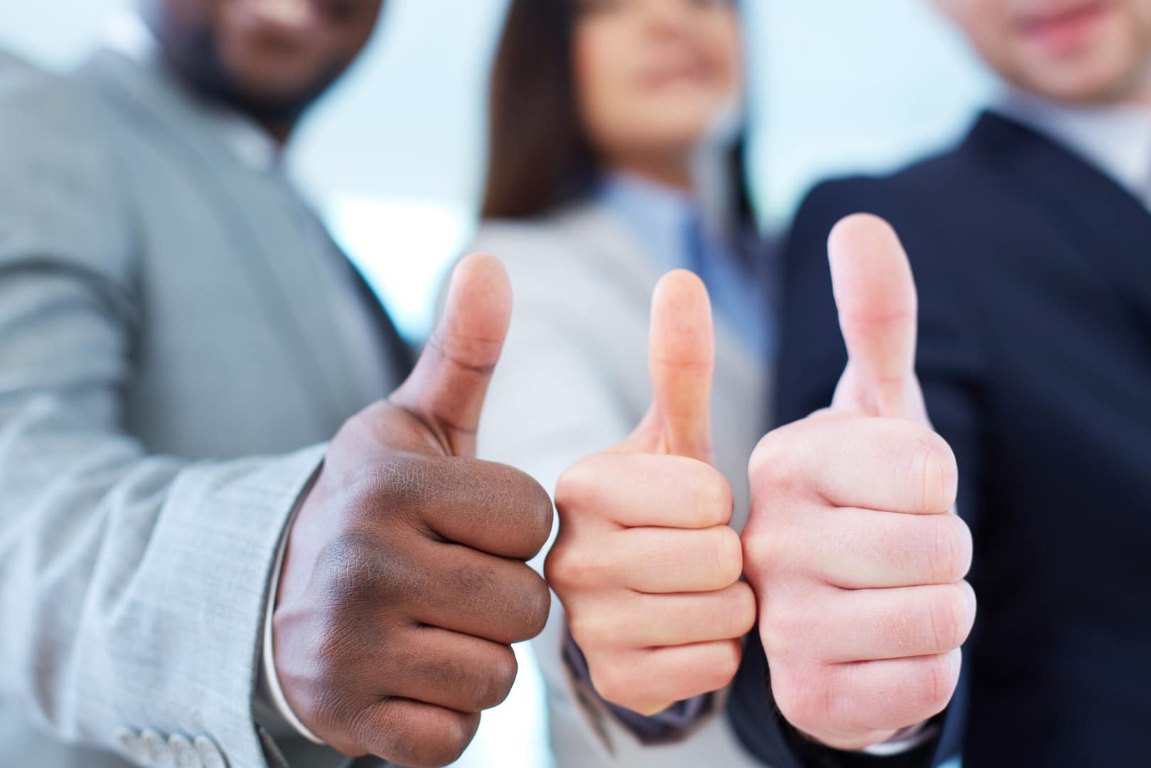 Networking 4 close up executives showing thumbs up scaled