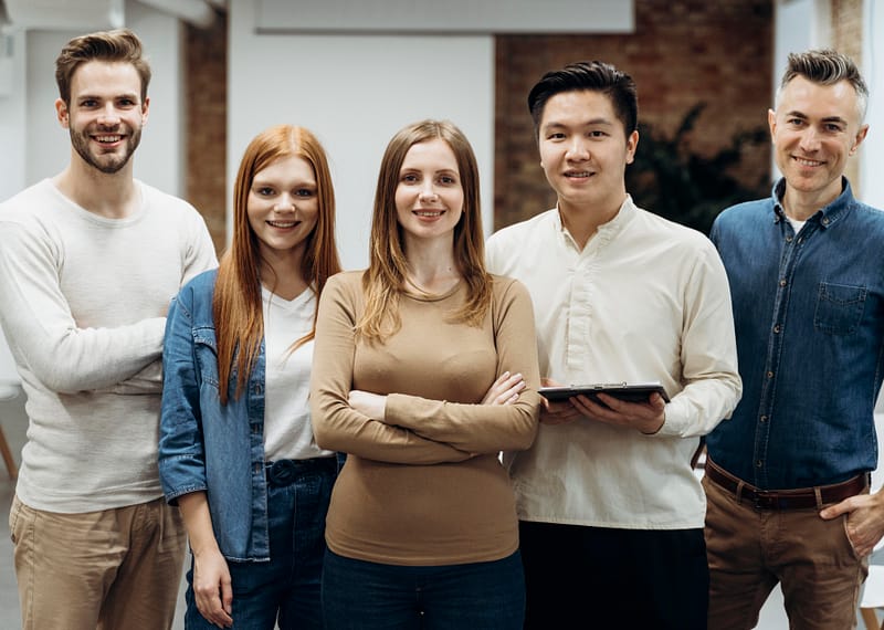 business people posing together office